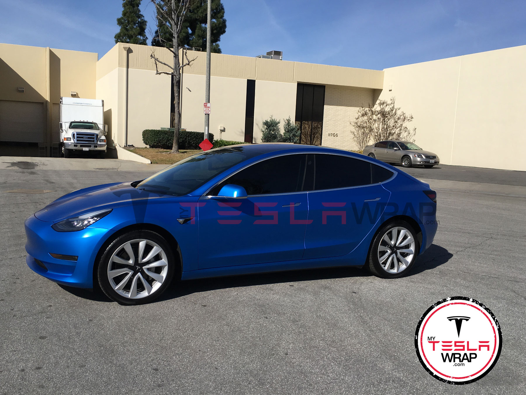 Tesla Model 3 Wrapped in Blue Sating Vinyl Wrap